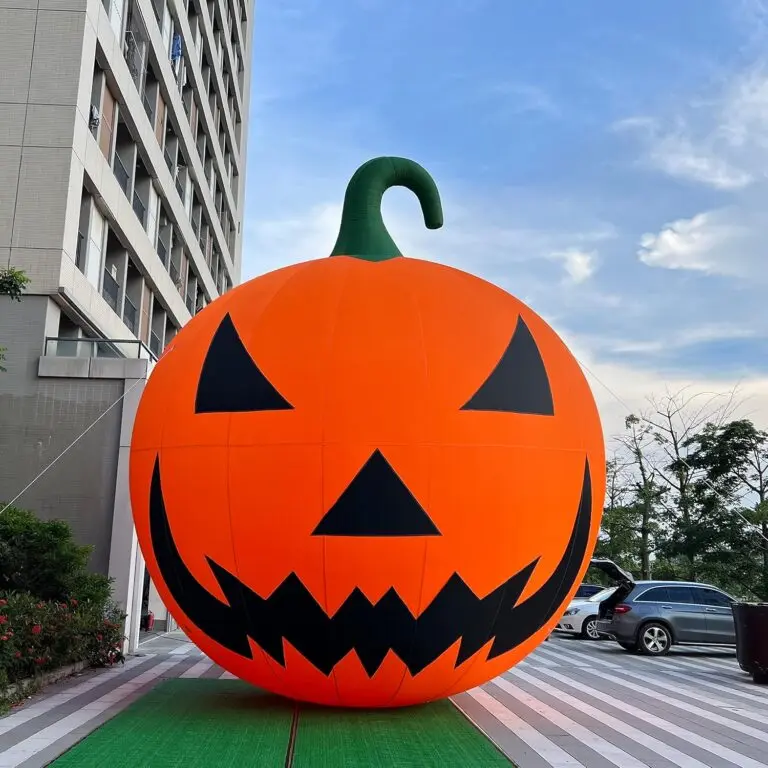 Giant inflatable jack-o-lantern on a city walkway