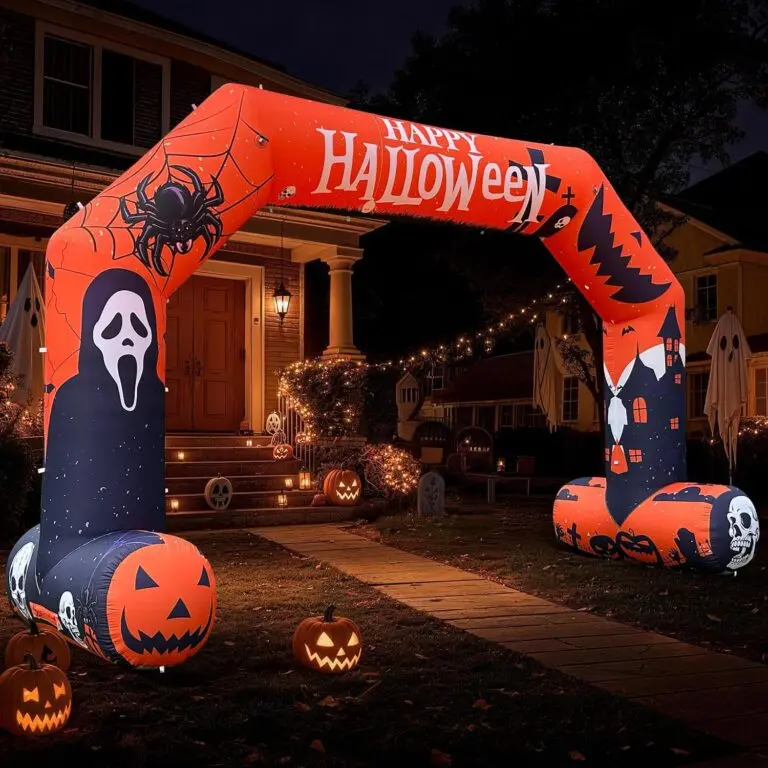 Halloween inflatable archway glowing in a front yard at night